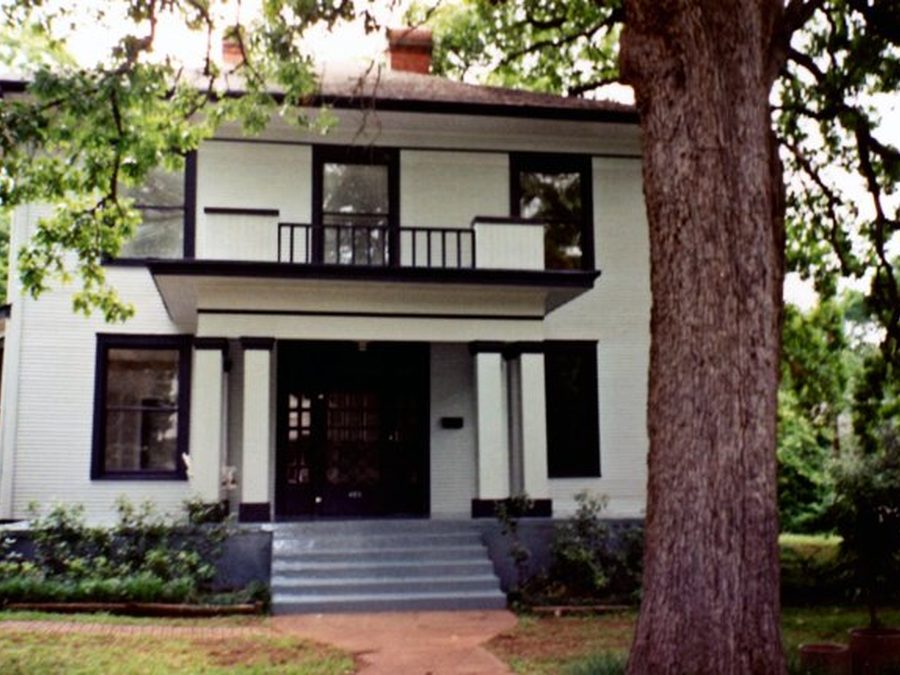 Exterior painting after — white two-story historic home, East Texas